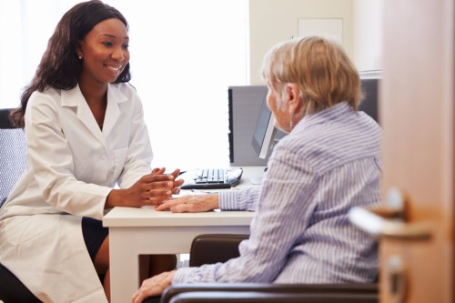 senior patient having consultation with doctor in office